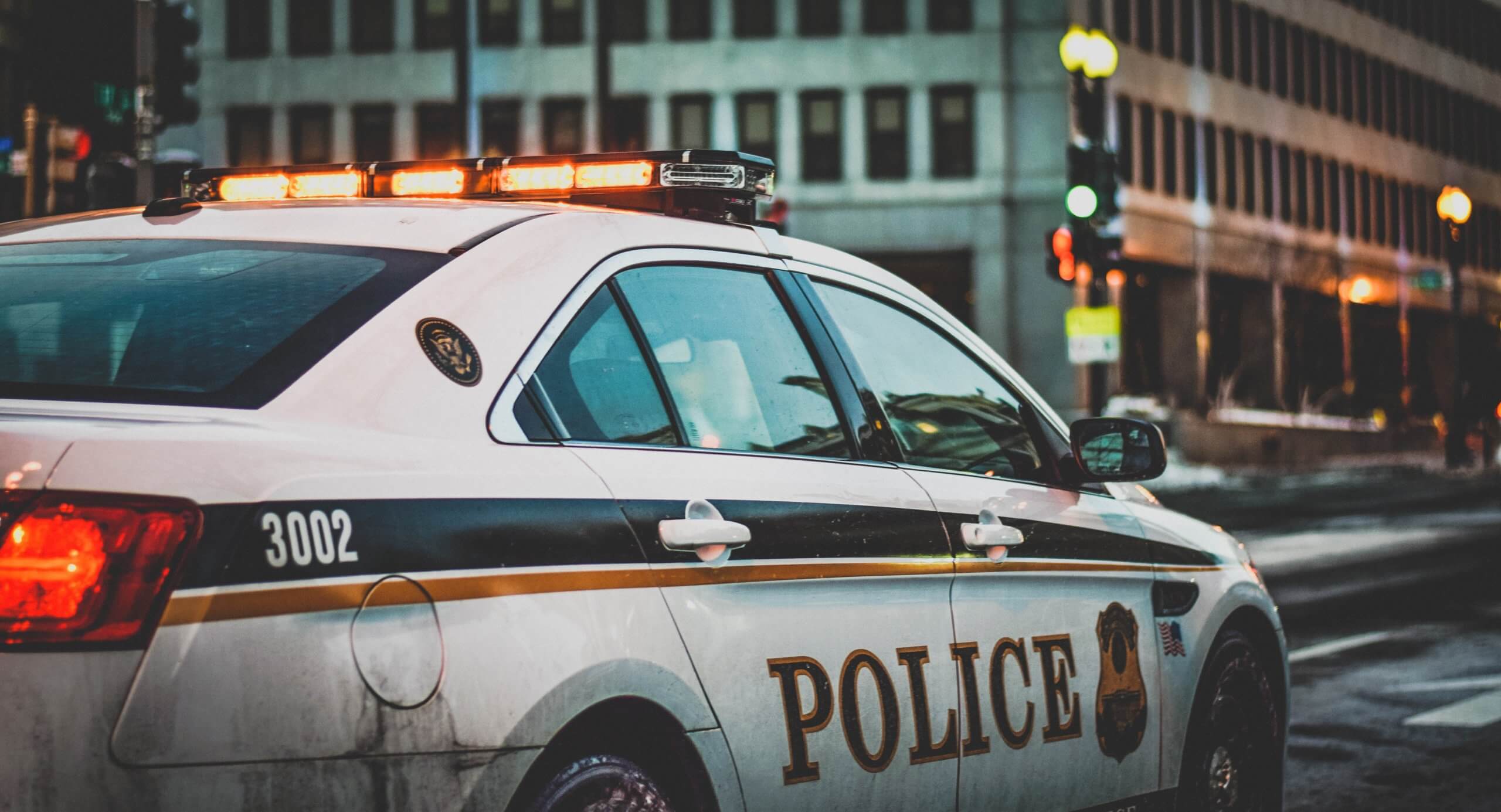 Police car on city street at night