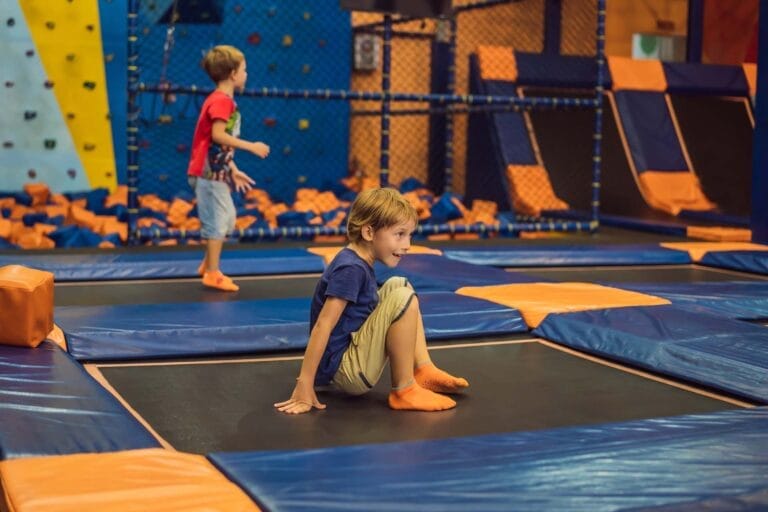 Children playing on indoor trampoline park.