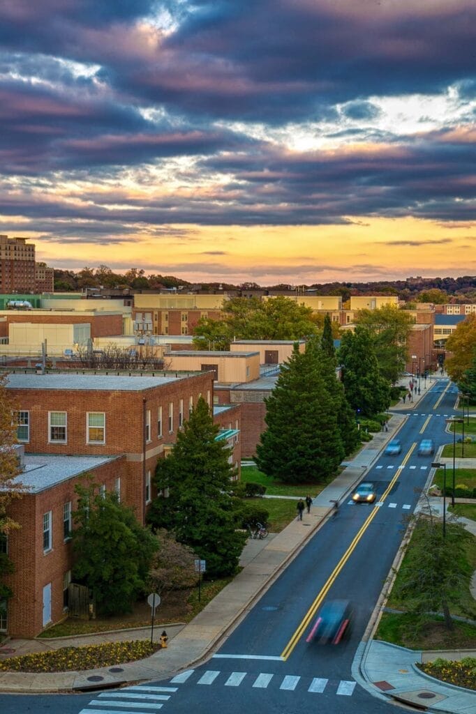 Sunset over urban street and buildings view.